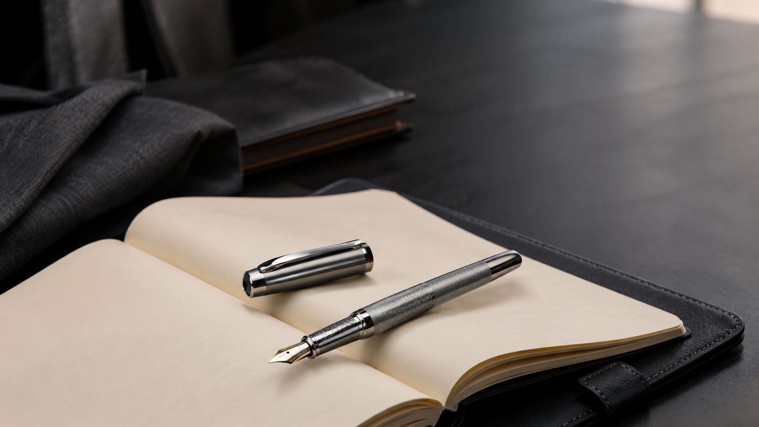 The Executive resting on an open journal on a leather desk